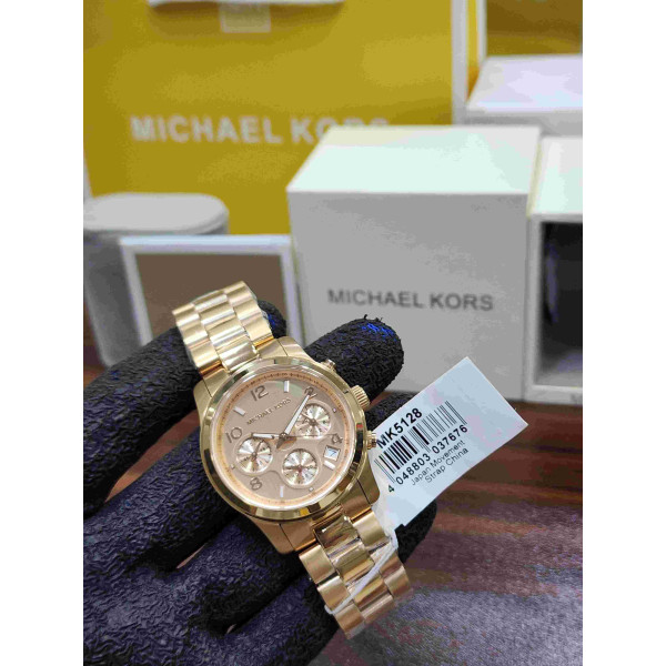 MK women’s chronograph watch featuring a luxurious gold-tone stainless steel watch
